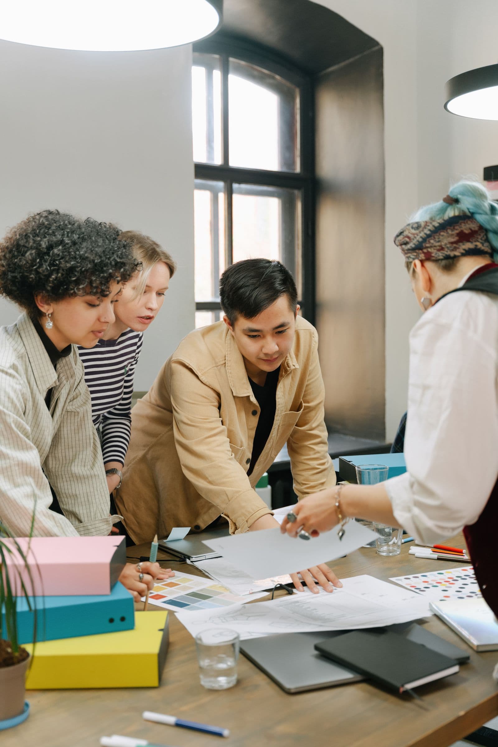 A team planning a project together around a table